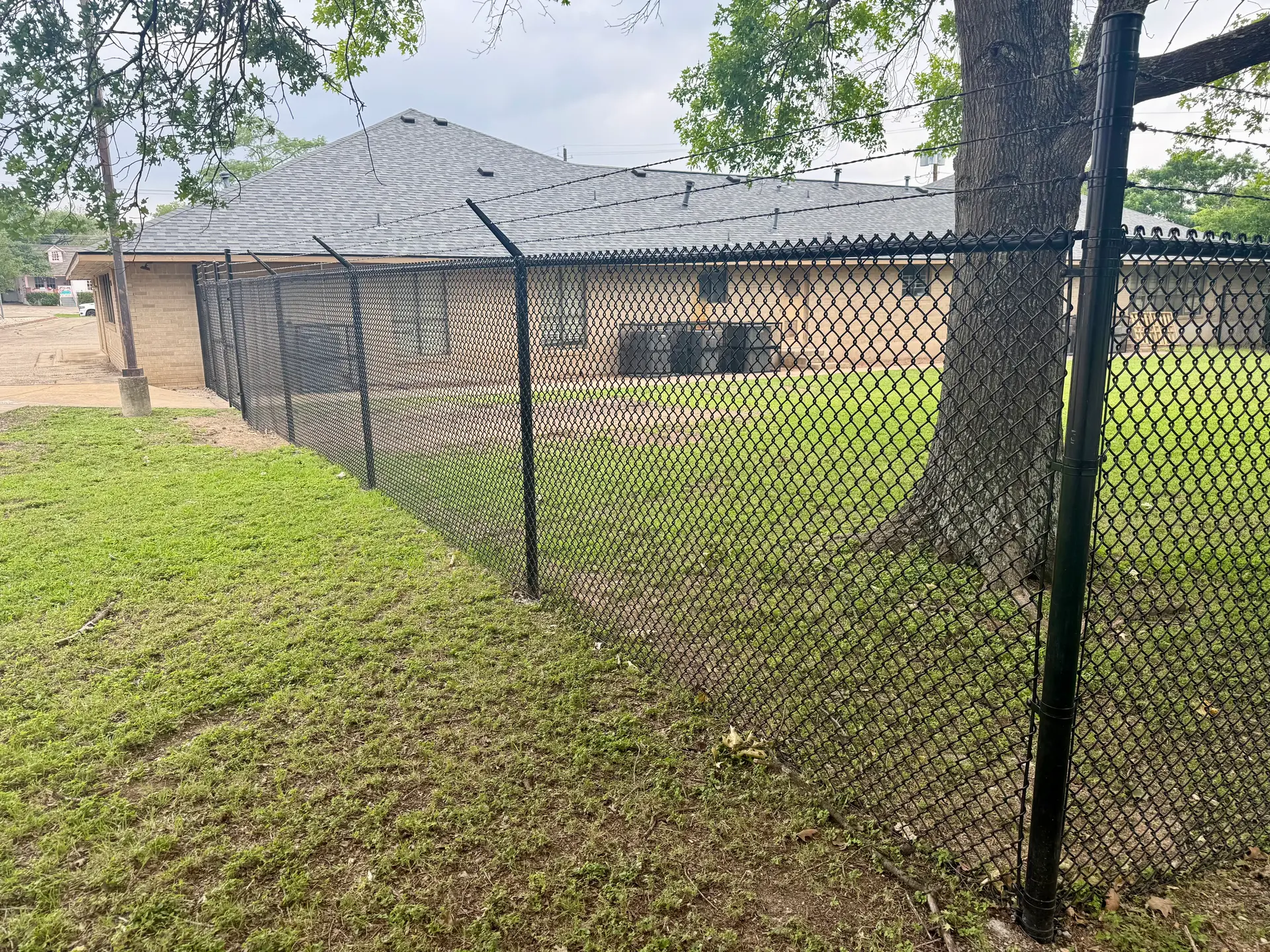 Black chain-link commercial security fence in Austin, TX